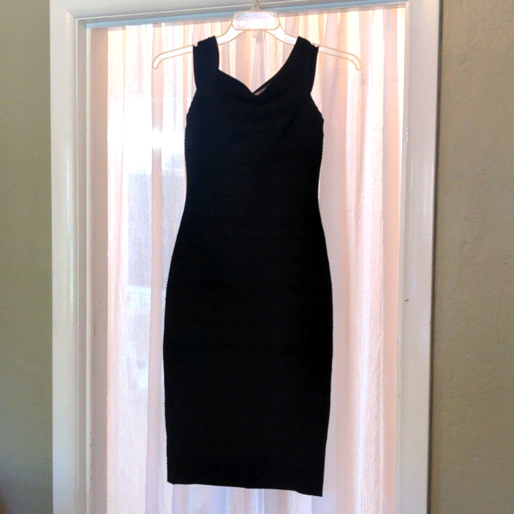 Like new Ted Baker London black stretch knit body con dress with stitch detail.